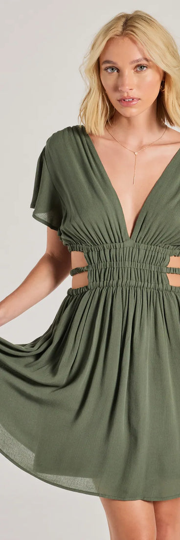 The Spice Things Up V-Neck Cutout Skater Dress is your new go-to olive green dress—effortless, versatile, and made to update your fall style in seconds.