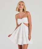 Step into winter chic with the Sweetie Status Halter Crochet Trim Babydoll Dress, a white mini dress featuring an above-the-knee cut ideal for cocktail parties, festive gatherings, or clubwear.