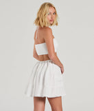 The Sweetie Status Halter Crochet Trim Babydoll Dress is a mini dress in white, perfect for an above-the-knee holiday party dress or a stylish NYE look, with a short hemline designed to make a winter statement.