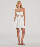 The Sweetie Status Halter Crochet Trim Babydoll Dress is a stunning white mini dress with a short hem, designed to be the perfect winter cocktail dress or night-out look for the holiday season.