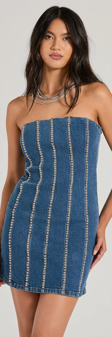 Essential for vacations or summer days, the Tell Me About It Stud Strapless Denim Mini Dress is a sundress or milkmaid dress with sleek and flirty details.