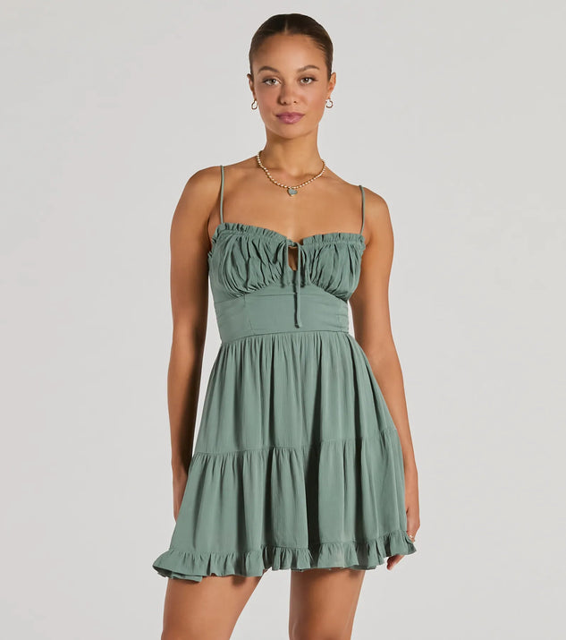 Step into winter chic with the A Sweet Look Sleeveless Ruffled Skater Dress, a sage mini dress featuring an above-the-knee cut ideal for cocktail parties, festive gatherings, or clubwear.