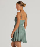 The A Sweet Look Sleeveless Ruffled Skater Dress is a mini dress in sage, perfect for an above-the-knee holiday party dress or a stylish NYE look, with a short hemline designed to make a winter statement.