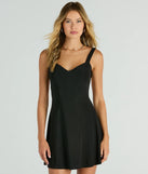 Step into winter chic with the Lost In Love Strappy Back A-Line Mini Dress, a black mini dress featuring an above-the-knee cut ideal for cocktail parties, festive gatherings, or clubwear.