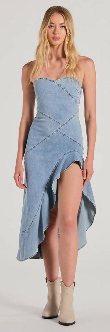 Essential for vacations or summer days, the Admiring Style Strapless Ruffle High Low Denim Dress is a sundress or milkmaid dress with sleek and flirty details.