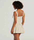 The Babe With Taste Buckle Strap Pleated Mini Dress is a mini dress in taupe, perfect for an above-the-knee holiday party dress or a stylish NYE look, with a short hemline designed to make a winter statement.