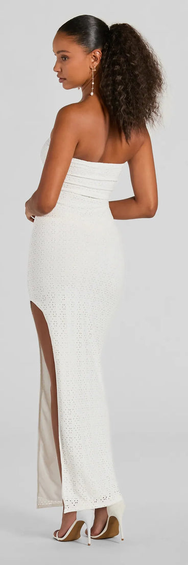 Essential for vacations or summer days, the Tuscan Charm Strapless Slit Eyelet Maxi Dress is a sundress or milkmaid dress with sleek and flirty details.