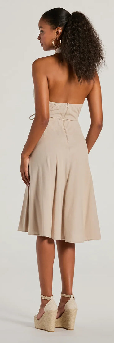 The Delightful Charm Halter A-Line Midi Dress is a natural midi dress, featuring an elevated midi-length silhouette perfect for wedding guest attire, romantic date nights, or effortless everyday styling.