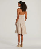 The Delightful Charm Halter A-Line Midi Dress is a natural midi dress, featuring an elevated midi-length silhouette perfect for wedding guest attire, romantic date nights, or effortless everyday styling.
