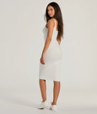 The Done In One Ribbed Knit Bodycon Midi Dress is a cozy sweater dress made from soft, stretchy fabric, perfect for layering on chilly winter days or dressing up as a warm holiday dress.