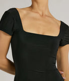 Step into seasonal chic with the Must-Have Tie Back A-Line Mini Dress, a black mini dress featuring an above-the-knee cut ideal for cocktail parties, festive gatherings, or clubwear.