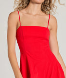 The Truly Charming Sleeveless A-Line Mini Dress is a stunning red mini dress with a short hem, designed to be the perfect winter cocktail dress or night-out look for the holiday season.