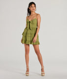 Step into winter chic with the Charming Allure Tie-Front Ruffled Skater Dress, a olive mini dress featuring an above-the-knee cut ideal for cocktail parties, festive gatherings, or clubwear.