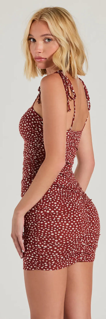 The Fun And Games Tie Strap Bodycon Floral Mini Dress is a stylish rust floral dress featuring a fresh seasonal print and flattering design, perfect for garden parties, bridal showers, Valentine's Day celebrations, or everyday spring styling.