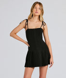 Make a bold statement in the Dream Twirl Tie Strap Pleated A-Line Mini Dress in black, the perfect spring dress for weddings, cocktail hours, nights out, and/or seasonal celebrations.