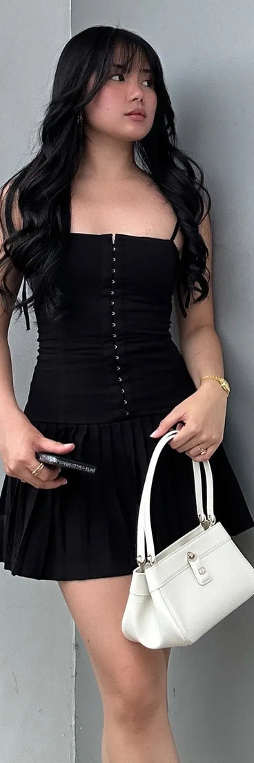 Soak up the season in the Dream Twirl Tie Strap Pleated A-Line Mini Dress, a black sundress styled for easy days, outdoor plans, and everything in between.