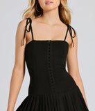 Make a bold statement in the Dream Twirl Tie Strap Pleated A-Line Mini Dress in black, the perfect spring dress for weddings, cocktail hours, nights out, and/or seasonal celebrations.