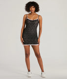 The Admire You Scoop Neck Layered Lace Mini Dress is a stunning black mini dress with a short hem, designed to be the perfect winter cocktail dress or night-out look for the holiday season.