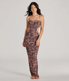 The stunning Serving Vibes Cutout Geometric Mesh Maxi Dress provides a chic silhouette and party-ready details that make it a standout black dress for cocktail events, New Year's Eve parties, or as a winter wedding guest look.