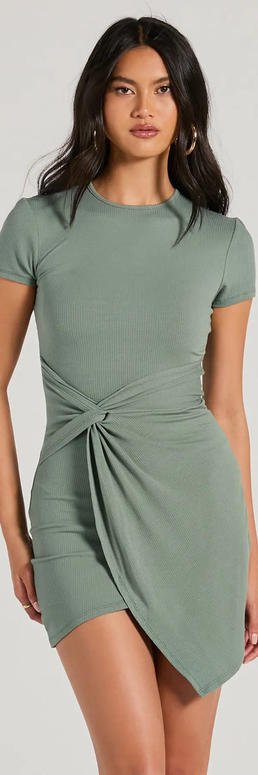 Make a bold statement in the Cutest Spirit Short Sleeve Knot Tie Mini Dress in olive green, the perfect green dress for weddings, cocktail hours, nights out, and/or seasonal celebrations.