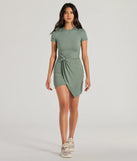 Make a bold statement in the Cutest Spirit Short Sleeve Knot Tie Mini Dress in olive green, the perfect green dress for weddings, cocktail hours, nights out, and/or seasonal celebrations.