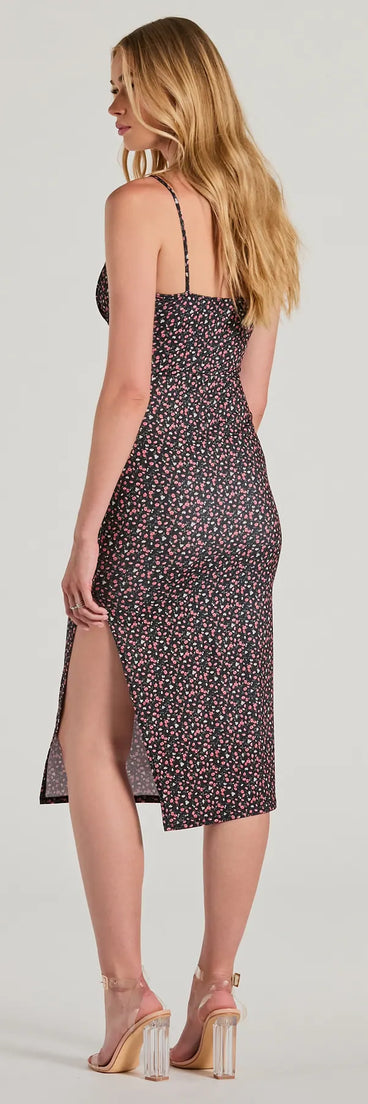 The Fit To Bloom Scoop Neck Ditsy Floral Midi Dress is a black midi dress, featuring an elevated midi-length silhouette perfect for wedding guest attire, romantic date nights, or effortless everyday styling.