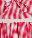 The Life's A Picnic Sweetheart Lace Gingham Mini Dress is a stylish red lace dress, designed with intricate lace and an alluring silhouette, making it an elegant choice for Easter, weddings, or effortless summer looks.