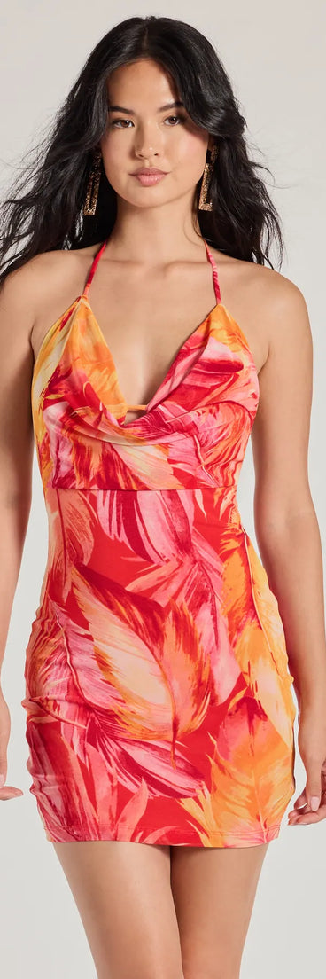 The Getaway Girl Halter Open Back Tropical Mini Dress is a mini dress that will make a statement with its short hemline and on-trend details to have you ready for any event!