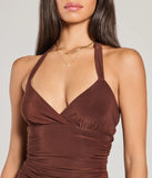 Step into seasonal chic with the Sassy Style Ruched Knit Halter Skater Dress, a brown mini dress featuring an above-the-knee cut ideal for cocktail parties, festive gatherings, or clubwear.