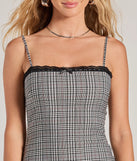 Step into seasonal chic with the Adorably Chic Lace Trim Plaid Mini Dress, a charcoal mini dress featuring an above-the-knee cut ideal for cocktail parties, festive gatherings, or clubwear.