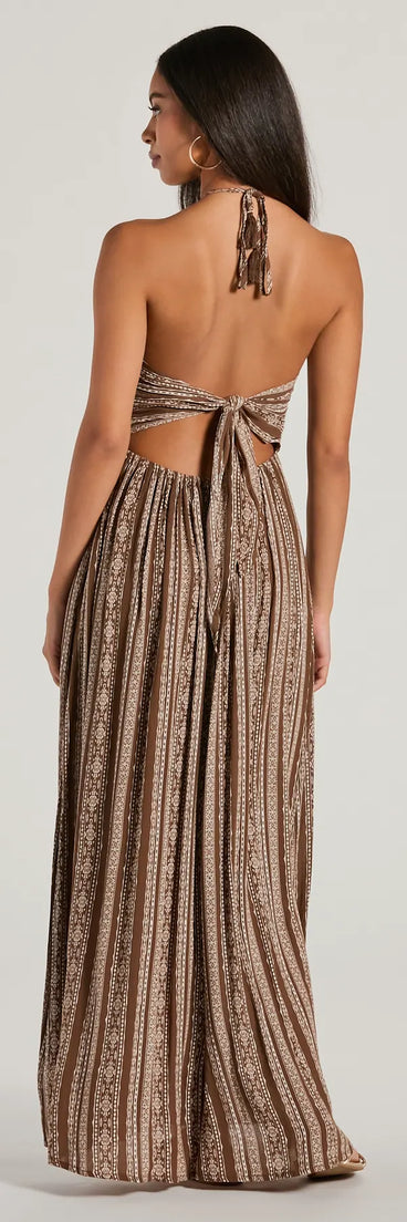 Essential for vacations or summer days, the Bohemian-Chic Geometric Striped Halter Maxi Dress is a sundress or milkmaid dress with sleek and flirty details.