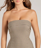 Step into winter chic with the Memorable Vibe Strapless Plaid Pleated Mini Dress, a tan mini dress featuring an above-the-knee cut ideal for cocktail parties, festive gatherings, or clubwear.