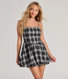 Step into seasonal chic with the Fall Flair Plaid Woven Bubble Hem Skater Dress, a black mini dress featuring an above-the-knee cut ideal for cocktail parties, festive gatherings, or clubwear.