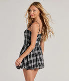 Revamp your 2025 wardrobe with this chic addition, the Fall Flair Plaid Woven Bubble Hem Skater Dress in black, perfect for elevating your style in the new year.