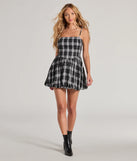Make a bold statement in the Fall Flair Plaid Woven Bubble Hem Skater Dress in black, the perfect spring dress for weddings, cocktail hours, nights out, and/or seasonal celebrations.