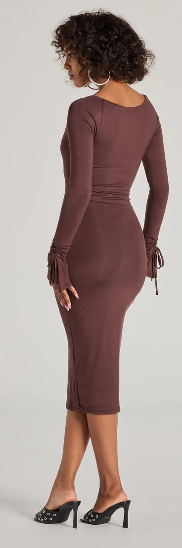 The Casual Chic Icon Long Sleeve Knit Midi Dress in brown features a flattering fit and mid-calf hem, redefining effortless midi dresses for any occasion.