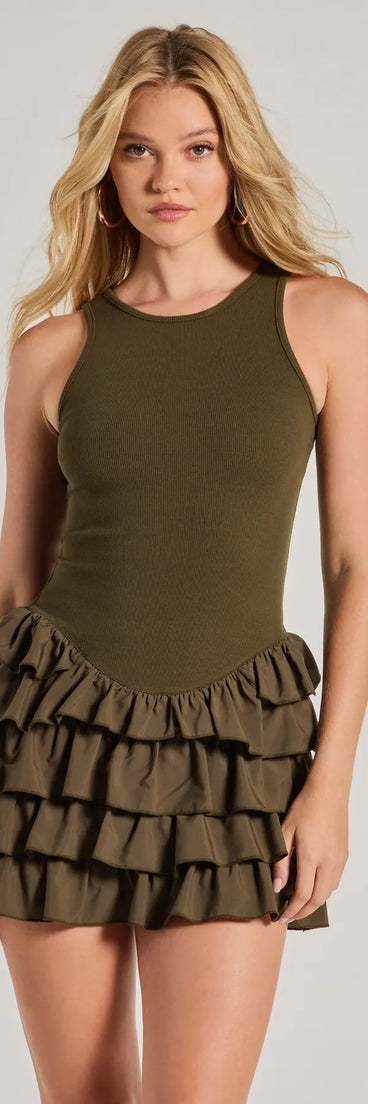 Here To Flirt Drop Waist Ruffled Skater Dress, a trendy olive green mini dress featuring modern details and a fresh seasonal hue, perfect for creating chic 2025 looks.