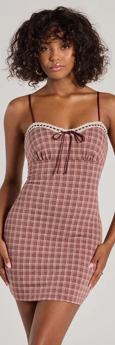 Step into seasonal chic with the Flirty Silhouette Lace Trim Plaid Mini Dress, a burgundy mini dress featuring an above-the-knee cut ideal for cocktail parties, festive gatherings, or clubwear.