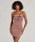 Step into seasonal chic with the Flirty Silhouette Lace Trim Plaid Mini Dress, a burgundy mini dress featuring an above-the-knee cut ideal for cocktail parties, festive gatherings, or clubwear.