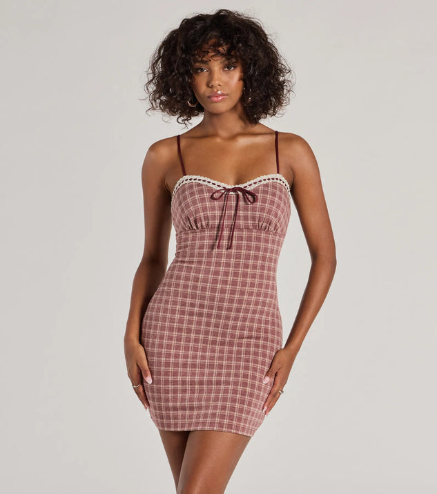 Step into seasonal chic with the Flirty Silhouette Lace Trim Plaid Mini Dress, a burgundy mini dress featuring an above-the-knee cut ideal for cocktail parties, festive gatherings, or clubwear.