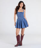 Step into summer looking effortlessly chic in the Darling Charm Halter Pleated Denim Skater Dress in denim blue, a must-have Windsor dress for your warm-weather wardrobe.