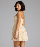The Sassy Sweet Floral Chiffon Ruffled Skater Dress in ivory brings sleek style to any graduation outfit, from cap and gown to after-party.