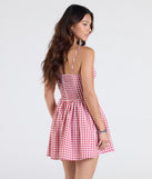 Make a bold statement in the Get Cutesy V-Neck Gingham Skater Dress in red, the perfect spring dress for weddings, cocktail hours, nights out, and/or seasonal celebrations.