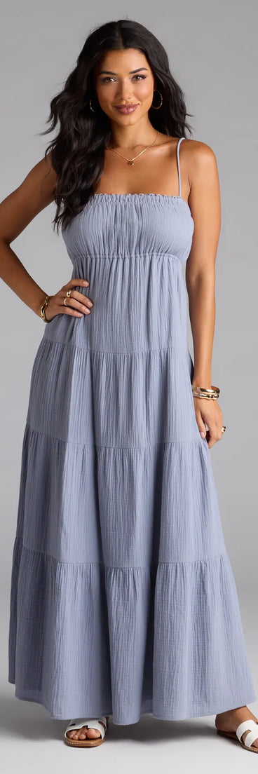 Step into the new season looking effortlessly chic in the Breezy Like Me Sleeveless Ruffled Maxi Dress in denim blue, a must-have Windsor dress for your cool-weather wardrobe.
