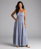 Step into summer looking effortlessly chic in the Breezy Like Me Sleeveless Ruffled Maxi Dress in denim blue, a must-have Windsor dress for your warm-weather wardrobe.
