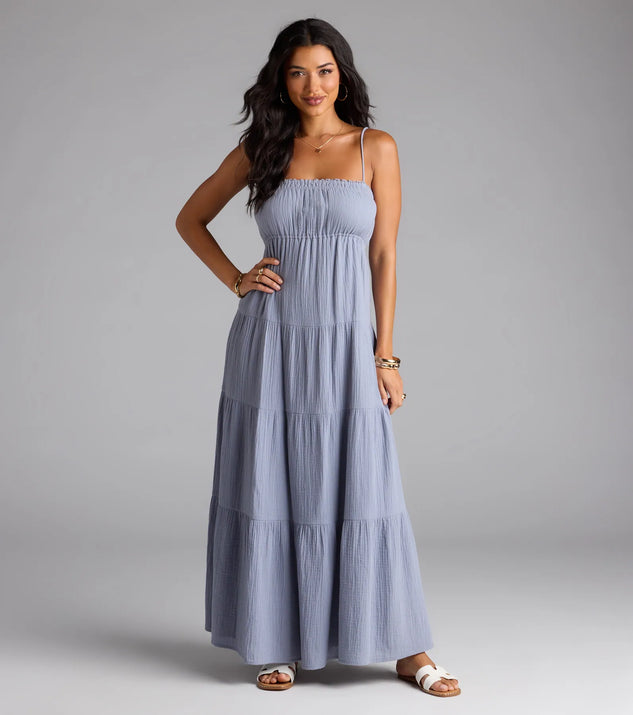 Step into summer looking effortlessly chic in the Breezy Like Me Sleeveless Ruffled Maxi Dress in denim blue, a must-have Windsor dress for your warm-weather wardrobe.