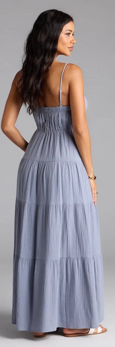 Soak up the season in the Breezy Like Me Sleeveless Ruffled Maxi Dress, a denim blue sundress styled for easy days, outdoor plans, and everything in between.