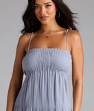 Step into summer looking effortlessly chic in the Breezy Like Me Sleeveless Ruffled Maxi Dress in denim blue, a must-have Windsor dress for your warm-weather wardrobe.