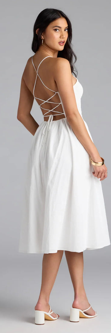 Soak up the season in the Easy And Breezy Lace-Up Midi Dress With Pockets, a ivory sundress styled for easy days, outdoor plans, and everything in between.