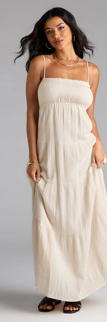 Step into the new season looking effortlessly chic in the Breezy Like Me Sleeveless Ruffled Maxi Dress in natural, a must-have Windsor dress for your cool-weather wardrobe.